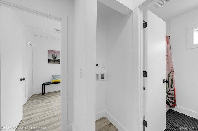 1641 Silman St, Ferndale, MI 48220 - laundry room with light wood-style floors and baseboards