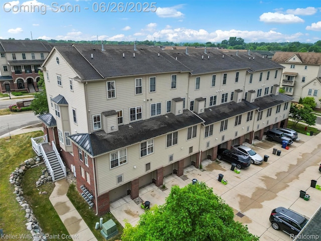3991 Forester Blvd, Auburn Hills, MI 48326 - view of property with stairs, a garage, and a residential view