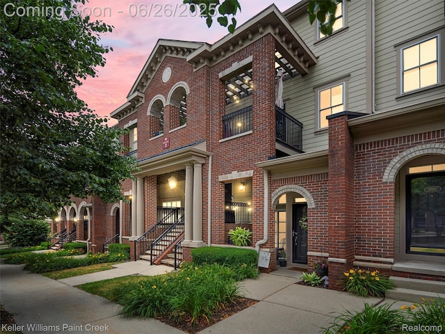 3991 Forester Blvd, Auburn Hills, MI 48326 - italianate house with brick siding and a balcony
