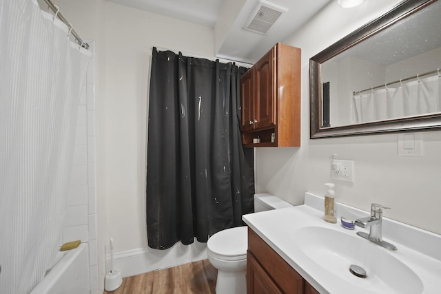 1302 Lansing Ave, Jackson, MI 49202 - bathroom with vanity, wood finished floors, and shower / bathtub combination with curtain
