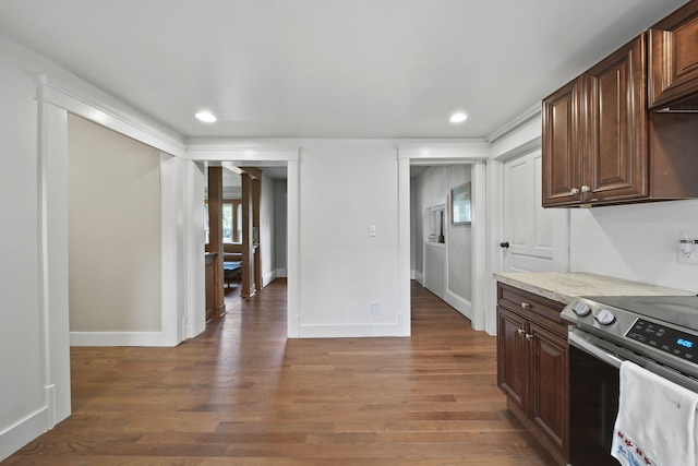 1302 Lansing Ave, Jackson, MI 49202 - kitchen featuring electric stove, recessed lighting, light wood finished floors, and dark brown cabinets