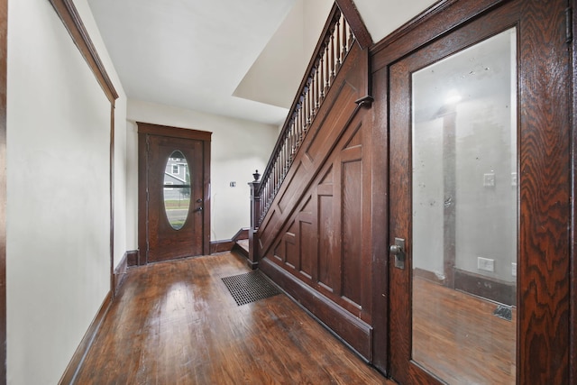 1302 Lansing Ave, Jackson, MI 49202 - foyer with dark wood-style flooring and stairs