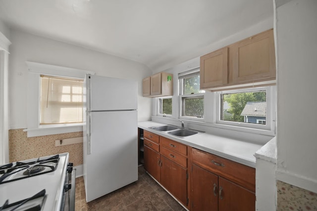 1302 Lansing Ave, Jackson, MI 49202 - kitchen with white appliances and light countertops