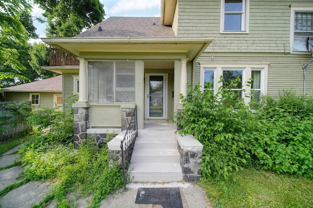 1302 Lansing Ave, Jackson, MI 49202 - property entrance with a shingled roof
