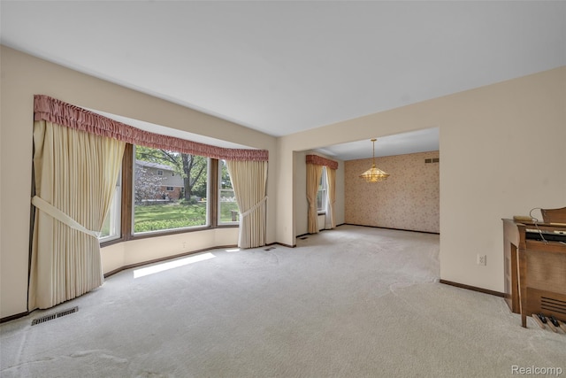 366 Tara Dr, Troy, MI 48085 - empty room with carpet flooring, wallpapered walls, and a chandelier