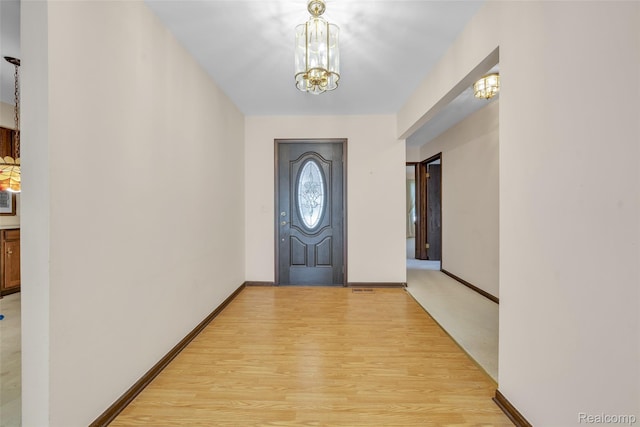 366 Tara Dr, Troy, MI 48085 - entryway with a chandelier and light wood-type flooring