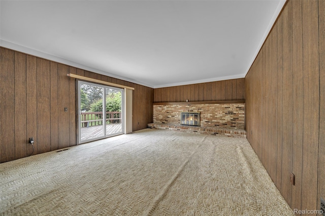 366 Tara Dr, Troy, MI 48085 - unfurnished living room featuring wooden walls, a fireplace, and carpet floors