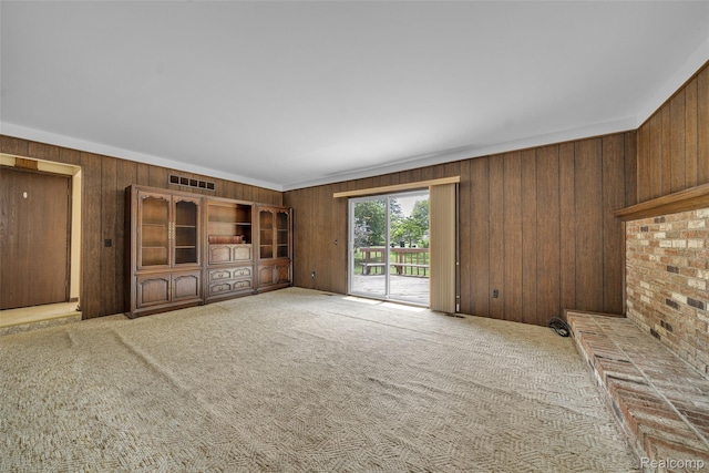 366 Tara Dr, Troy, MI 48085 - unfurnished living room with wood walls and carpet floors