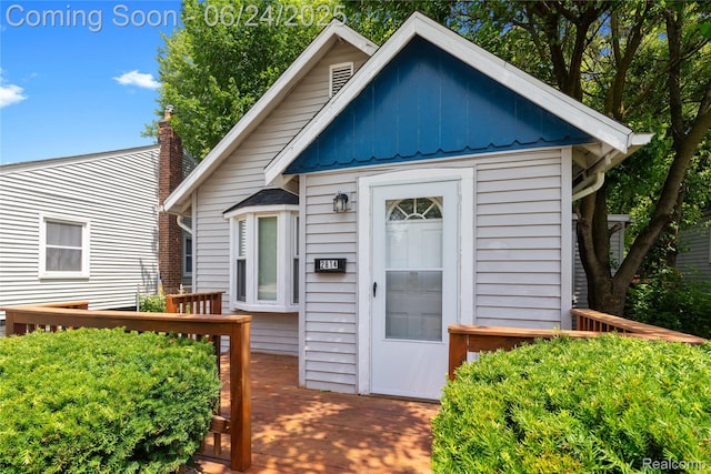 2814 Crooks Rd, Royal Oak, MI 48073 - view of front of house featuring a wooden deck and board and batten siding