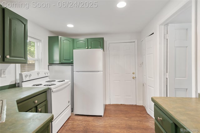 2814 Crooks Rd, Royal Oak, MI 48073 - kitchen with green cabinetry, white appliances, recessed lighting, light wood-style flooring, and light countertops