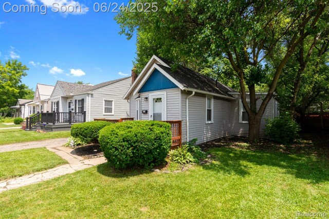 2814 Crooks Rd, Royal Oak, MI 48073 - view of front of house with a deck and a front yard