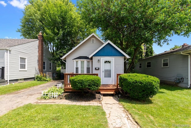 2814 Crooks Rd, Royal Oak, MI 48073 - bungalow-style home featuring a front yard and a wooden deck
