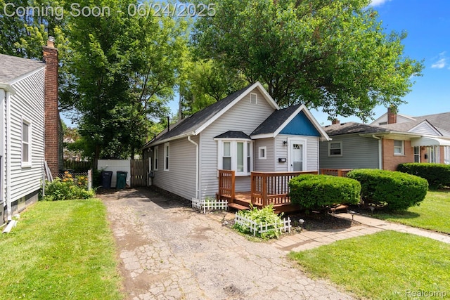 2814 Crooks Rd, Royal Oak, MI 48073 - view of front of house featuring a wooden deck and asphalt driveway