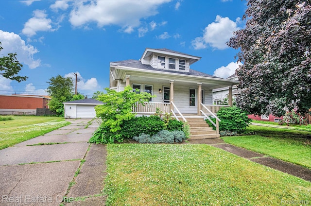 22500 Boulder Ave, Eastpointe, MI 48021 - bungalow-style home featuring a porch, a detached garage, and a front yard