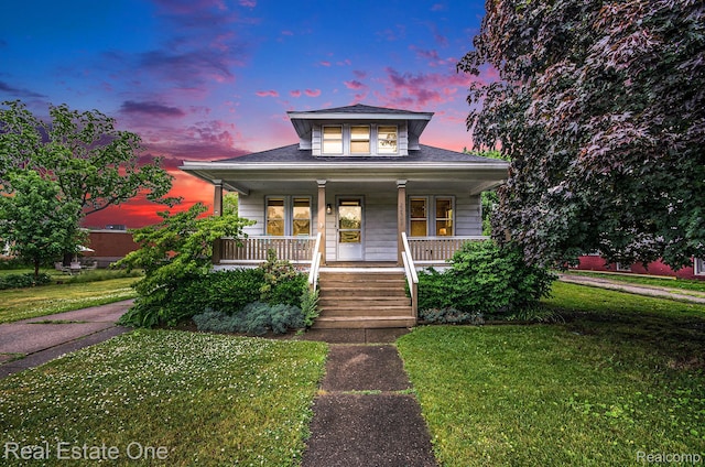 22500 Boulder Ave, Eastpointe, MI 48021 - bungalow-style house with covered porch and a yard