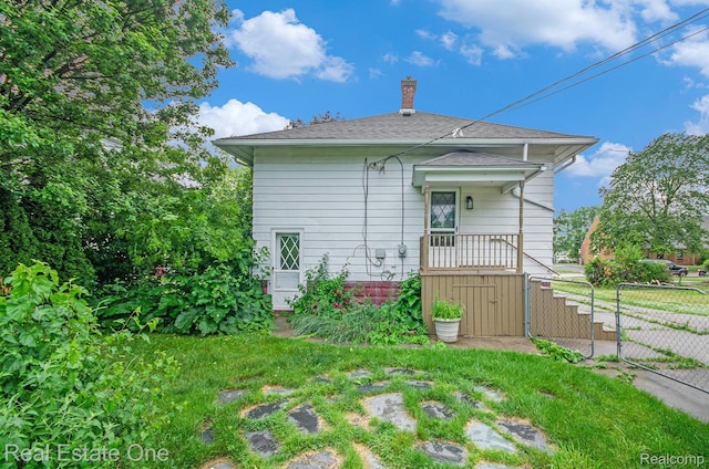 22500 Boulder Ave, Eastpointe, MI 48021 - rear view of house featuring a chimney