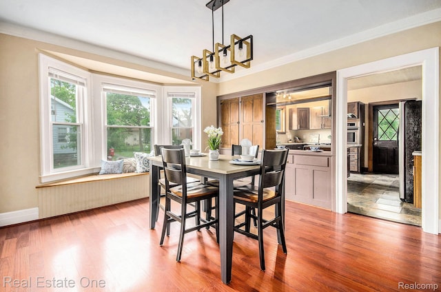 22500 Boulder Ave, Eastpointe, MI 48021 - dining area with wood finished floors and a chandelier