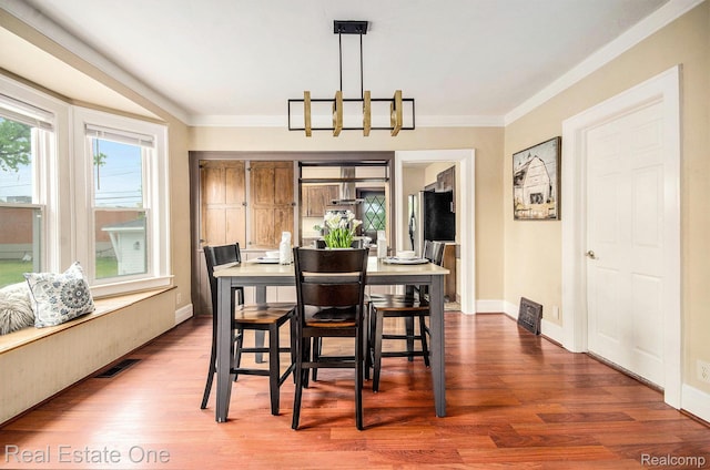 22500 Boulder Ave, Eastpointe, MI 48021 - dining area with wood finished floors and crown molding