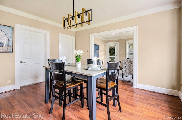 22500 Boulder Ave, Eastpointe, MI 48021 - dining space with a chandelier, crown molding, and wood finished floors
