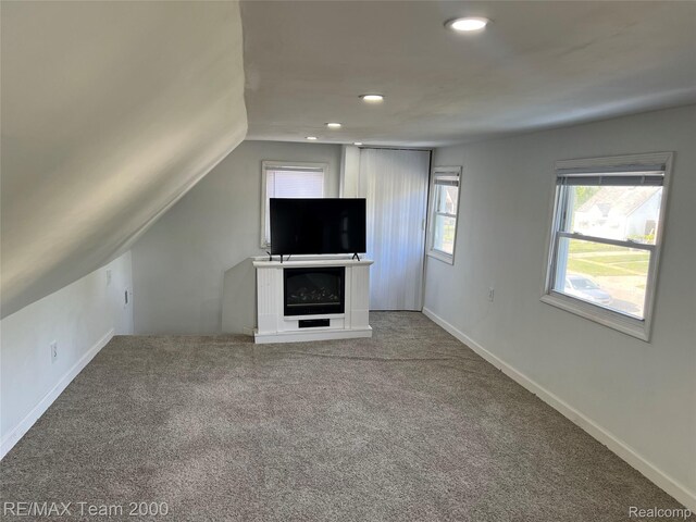 4064 Moore St, Inkster, MI 48141 - unfurnished living room featuring vaulted ceiling, carpet, and recessed lighting