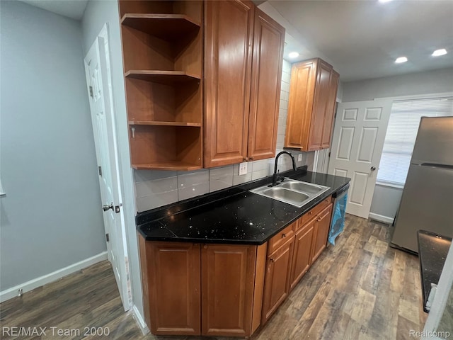 4064 Moore St, Inkster, MI 48141 - kitchen with appliances with stainless steel finishes, backsplash, dark wood-type flooring, recessed lighting, and brown cabinets