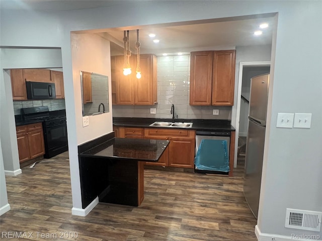 4064 Moore St, Inkster, MI 48141 - kitchen with black appliances, dark countertops, backsplash, dark wood-style floors, and brown cabinets