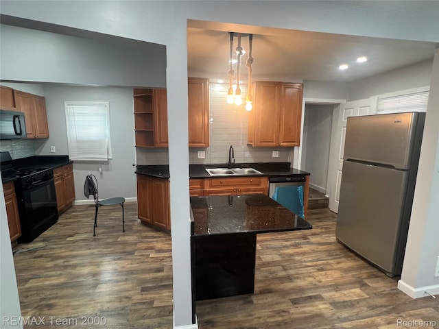 4064 Moore St, Inkster, MI 48141 - kitchen with black appliances, tasteful backsplash, dark wood-style flooring, hanging light fixtures, and recessed lighting