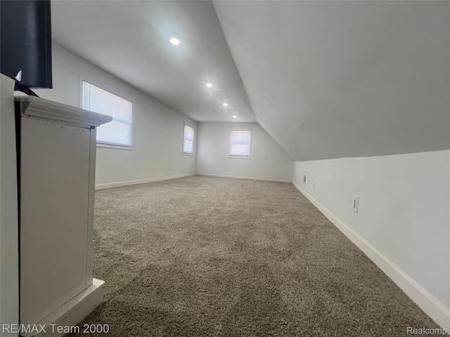 4064 Moore St, Inkster, MI 48141 - additional living space with carpet, healthy amount of natural light, recessed lighting, and lofted ceiling