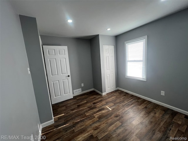4064 Moore St, Inkster, MI 48141 - unfurnished bedroom with recessed lighting, dark wood-style flooring, and a closet