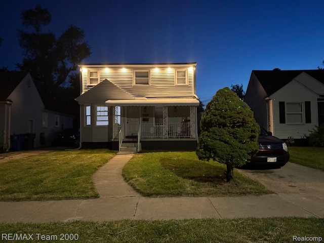 4064 Moore St, Inkster, MI 48141 - view of front of house featuring a porch and a front lawn