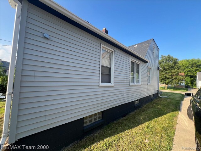 4064 Moore St, Inkster, MI 48141 - view of side of property with a yard and a chimney