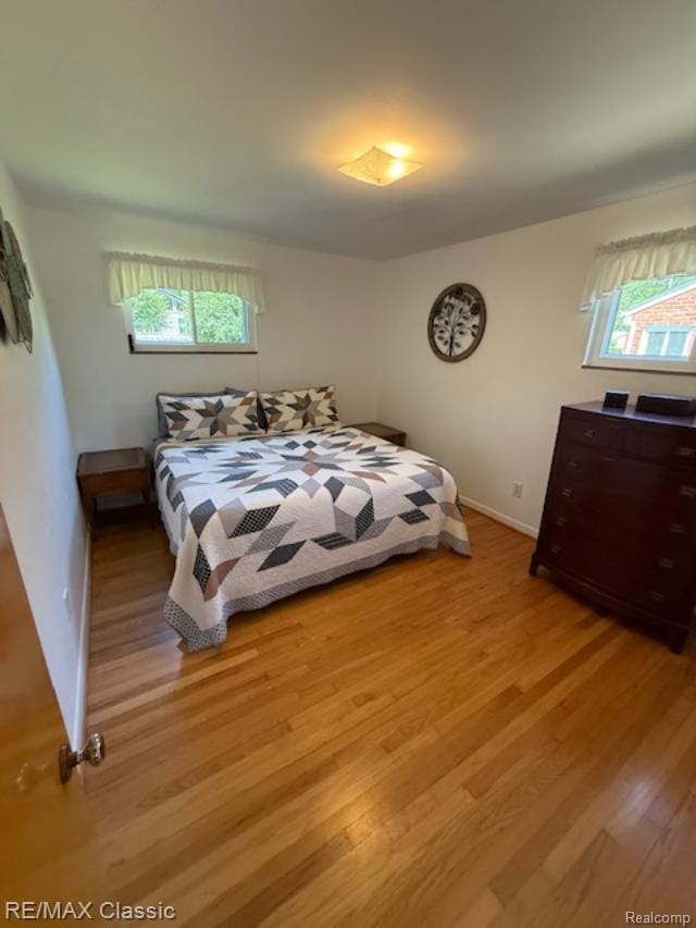32354 Leelane, Farmington, MI 48336 - bedroom featuring light wood-type flooring and multiple windows