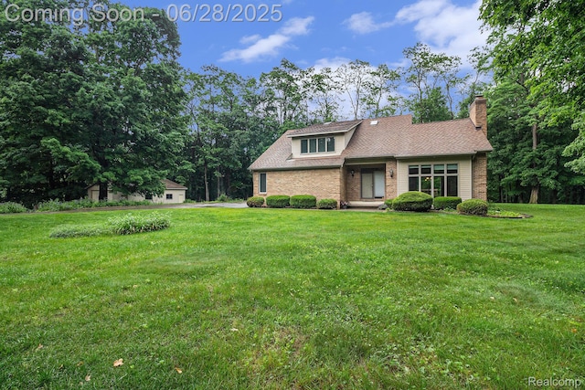 6375 Perryville Rd, Holly, MI 48442 - view of front of property with a front yard, brick siding, a chimney, and roof with shingles
