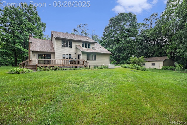 6375 Perryville Rd, Holly, MI 48442 - rear view of house featuring a wooden deck, a lawn, a chimney, and a shingled roof