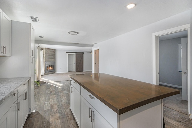 9922 S Sprinkle Rd, Portage, MI 49002 - kitchen featuring wood counters, open floor plan, dark wood finished floors, a center island, and recessed lighting