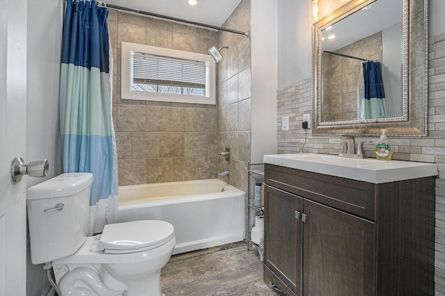 9922 S Sprinkle Rd, Portage, MI 49002 - bathroom featuring shower / tub combo with curtain, vanity, and wood finished floors