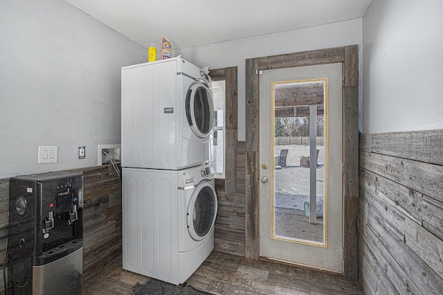 9922 S Sprinkle Rd, Portage, MI 49002 - laundry area featuring stacked washing machine and dryer and dark wood-style floors