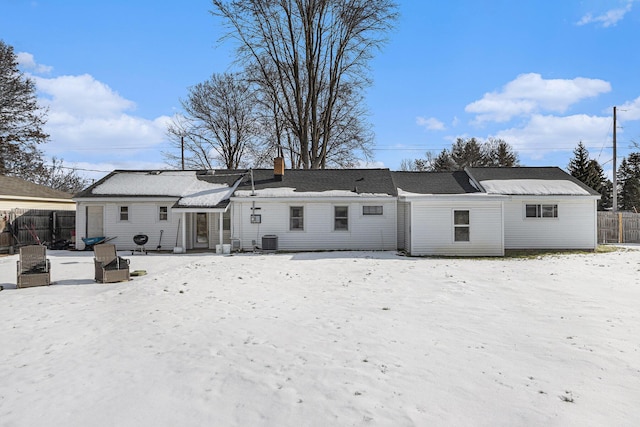 9922 S Sprinkle Rd, Portage, MI 49002 - snow covered rear of property with a chimney