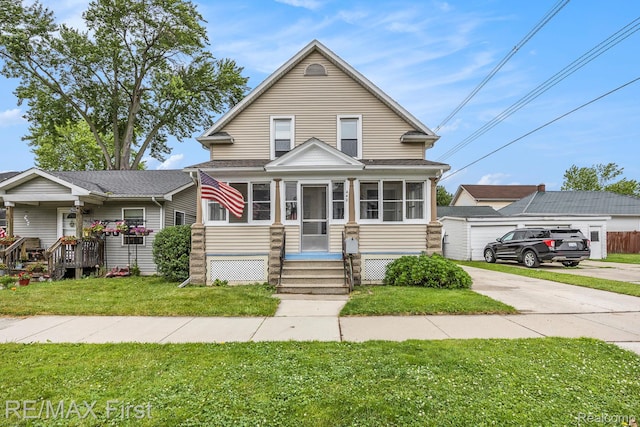 442 Washington St, Marine City, MI 48039 - view of front facade with a front lawn, a sunroom, and driveway