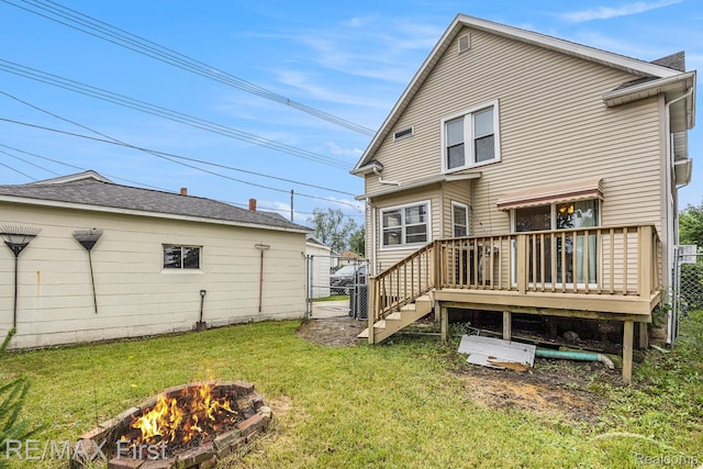 442 Washington St, Marine City, MI 48039 - rear view of house featuring an outdoor fire pit, a gate, and a deck