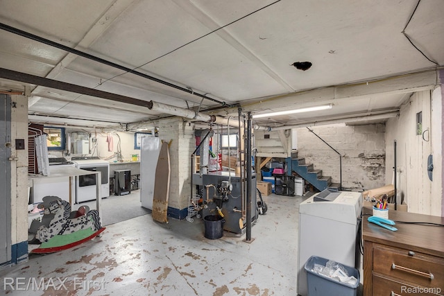 442 Washington St, Marine City, MI 48039 - below grade area featuring independent washer and dryer, stairs, and a heating unit