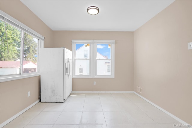 19186 Lamont St, Detroit, MI 48234 - kitchen featuring white fridge with ice dispenser and baseboards