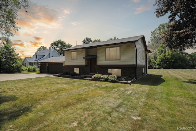 3395 W Maple Rd, Wixom, MI 48393 - bi-level home featuring a garage and a front lawn