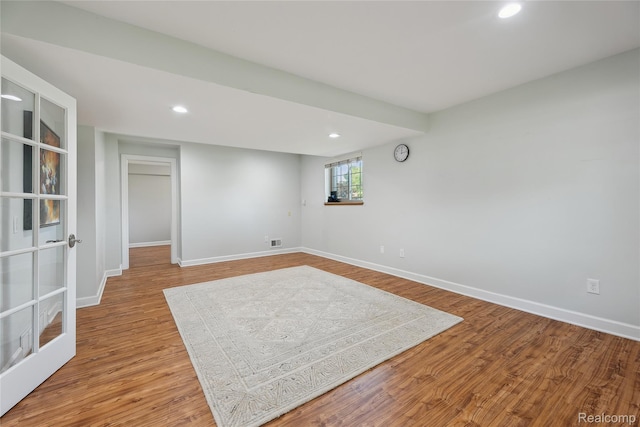 3395 W Maple Rd, Wixom, MI 48393 - below grade area featuring recessed lighting and wood finished floors