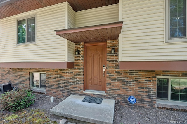 3395 W Maple Rd, Wixom, MI 48393 - view of exterior entry with brick siding