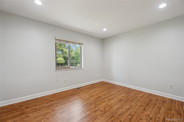3395 W Maple Rd, Wixom, MI 48393 - empty room featuring recessed lighting and wood finished floors