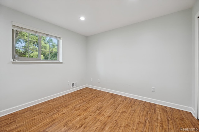 3395 W Maple Rd, Wixom, MI 48393 - unfurnished room featuring light wood-type flooring and recessed lighting