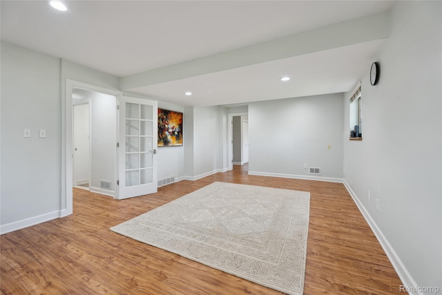 3395 W Maple Rd, Wixom, MI 48393 - below grade area featuring wood finished floors and recessed lighting