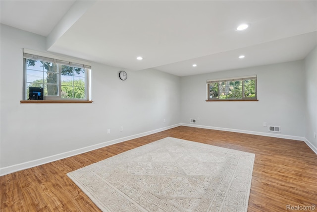 3395 W Maple Rd, Wixom, MI 48393 - spare room featuring wood finished floors and recessed lighting