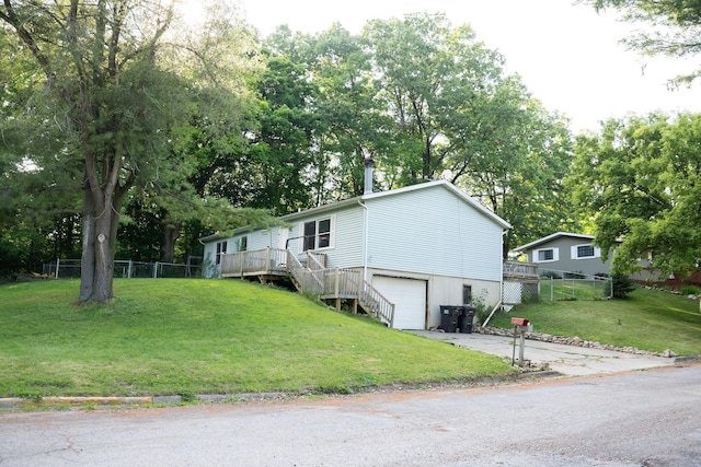 181 Spring St, Hillsdale, MI 49242 - view of front facade with a garage, driveway, view of scattered trees, and stairway